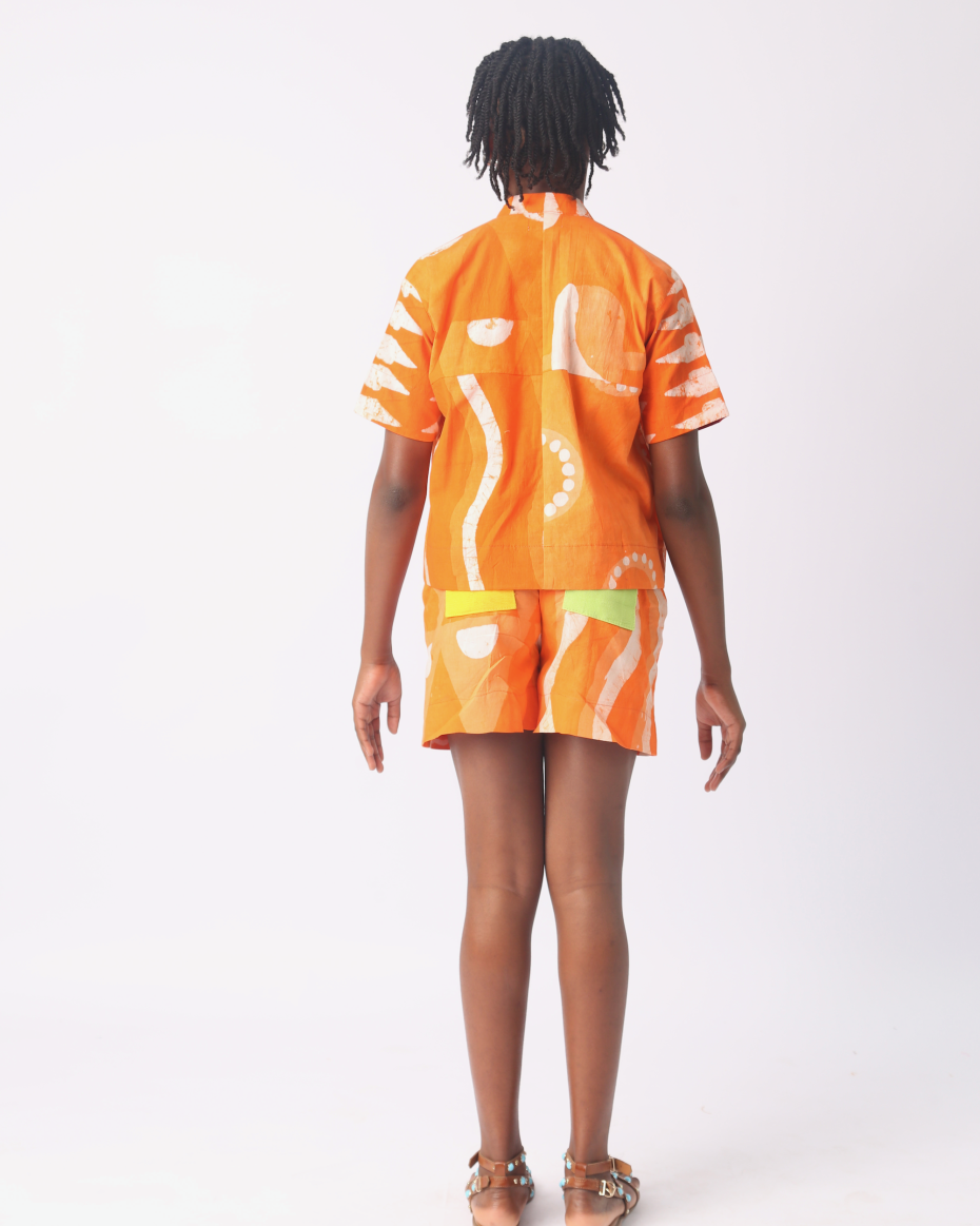KIDS WHITE AND TANGERINE MULTIPRINT SHORTS