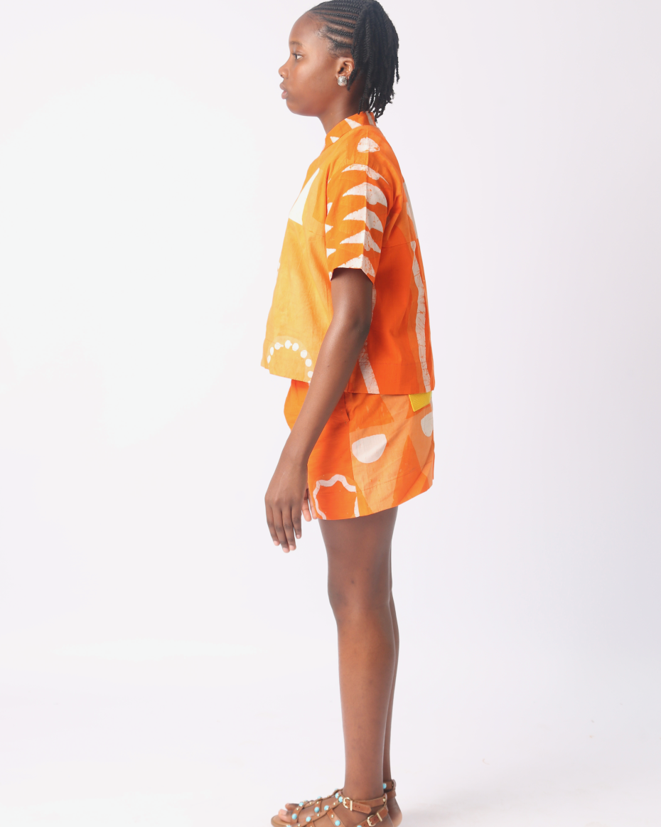 KIDS WHITE AND TANGERINE MULTIPRINT SHORTS